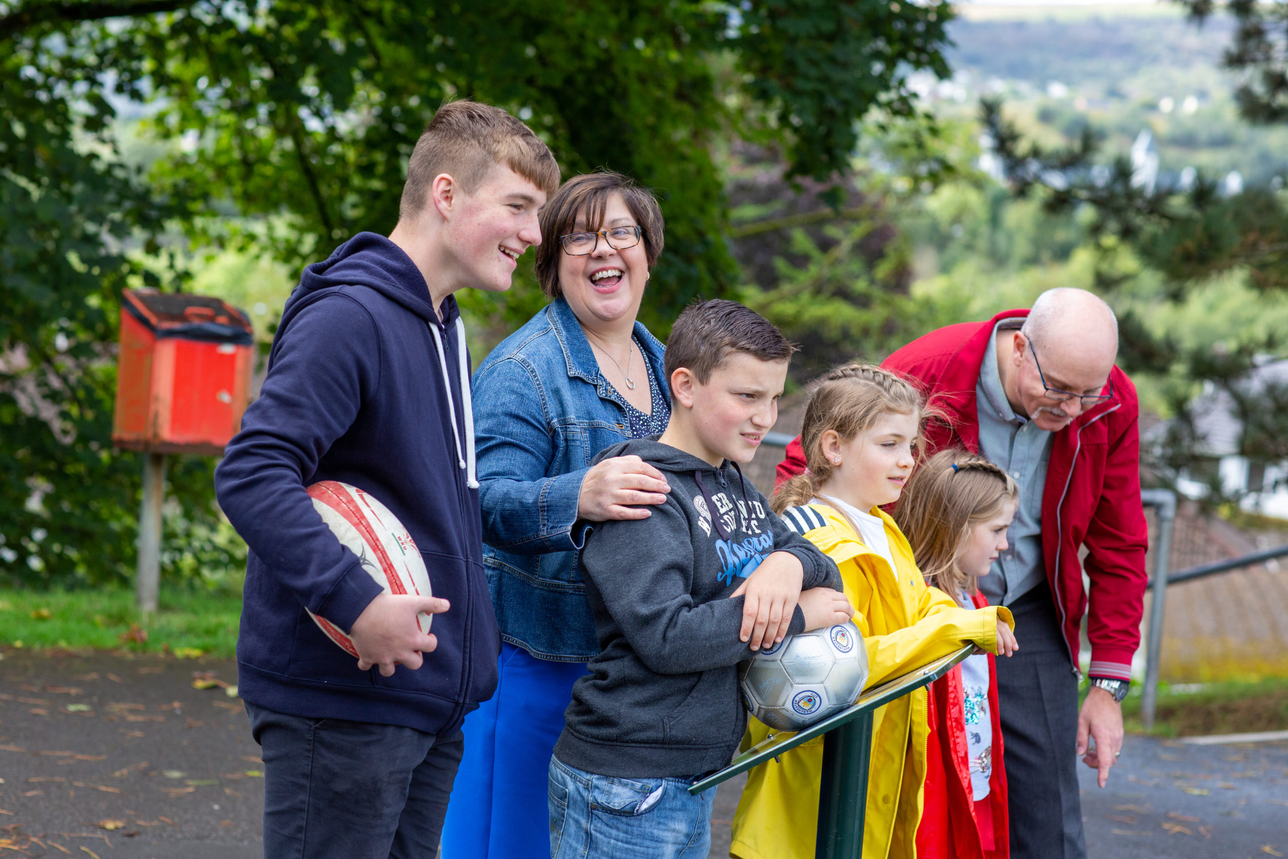 Family of six looking and laughing